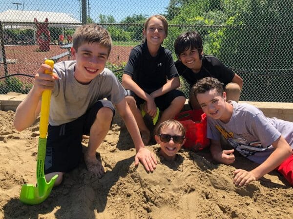 dude-camp boys at camp in the sand