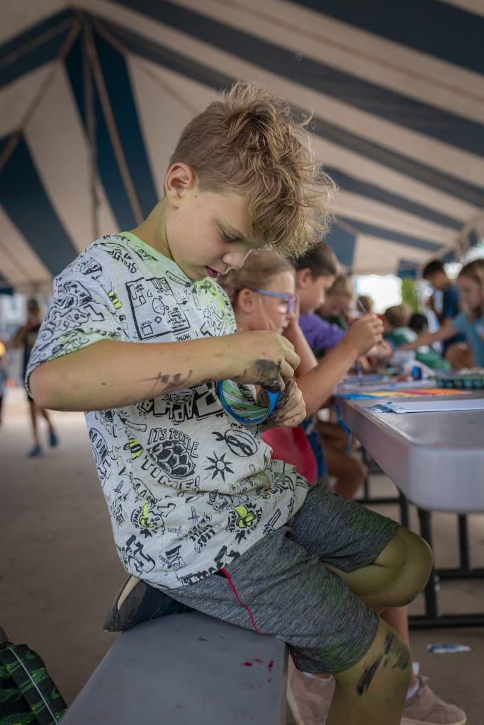 Camp Mirage Crafting kid crafting at camp