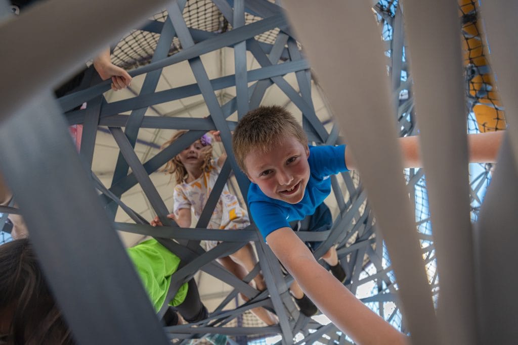kid climbing at camp mirage
